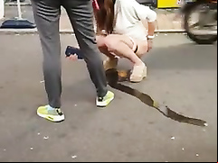 Korean girl pees on the street and gets taped