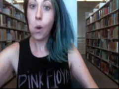 Funny babe in a tank top flashes tits in the library